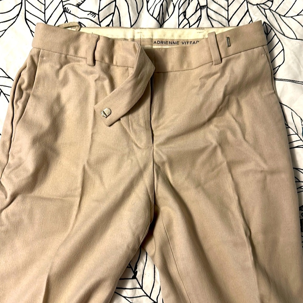Beige trousers.